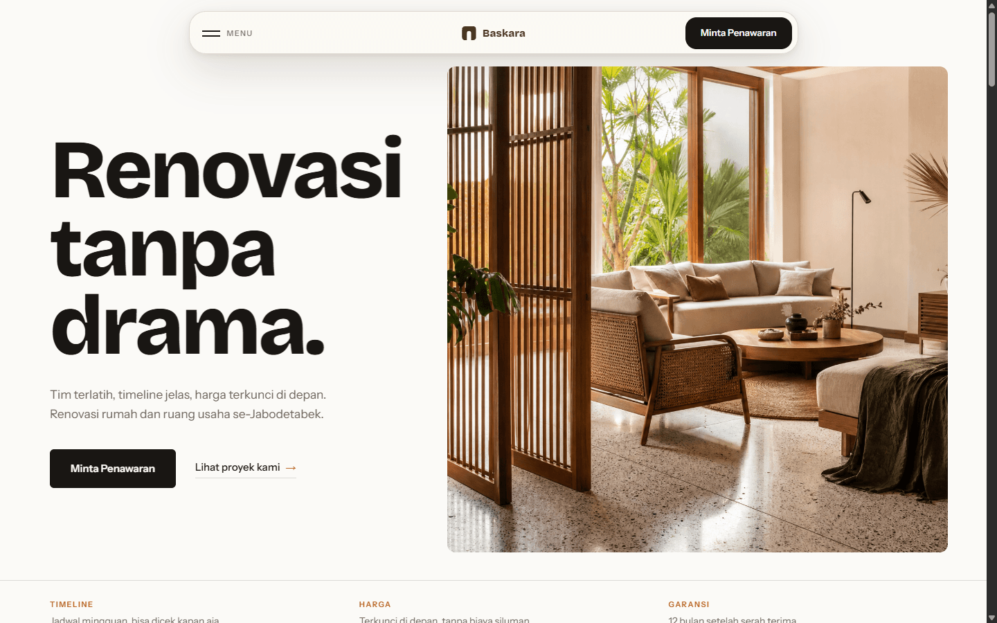 Website Baskara Renovasi dalam frame laptop